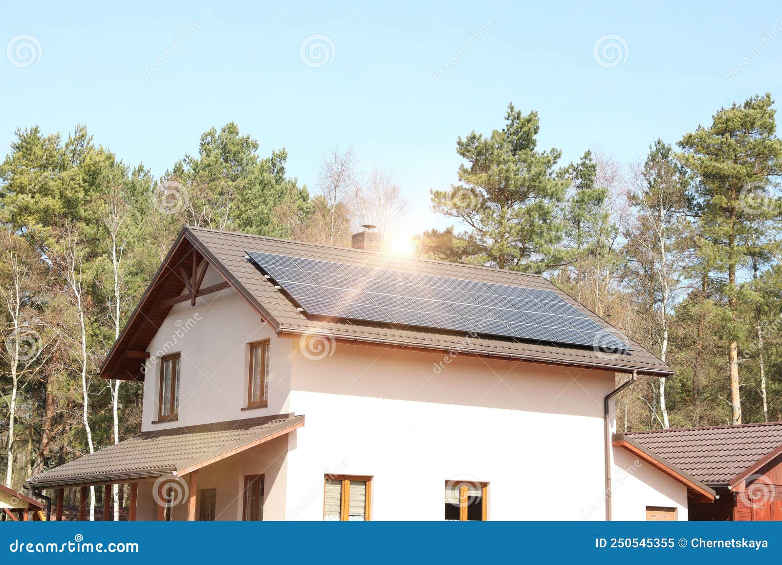 House with Installed Solar Panels on Roof. Alternative Energy Stock