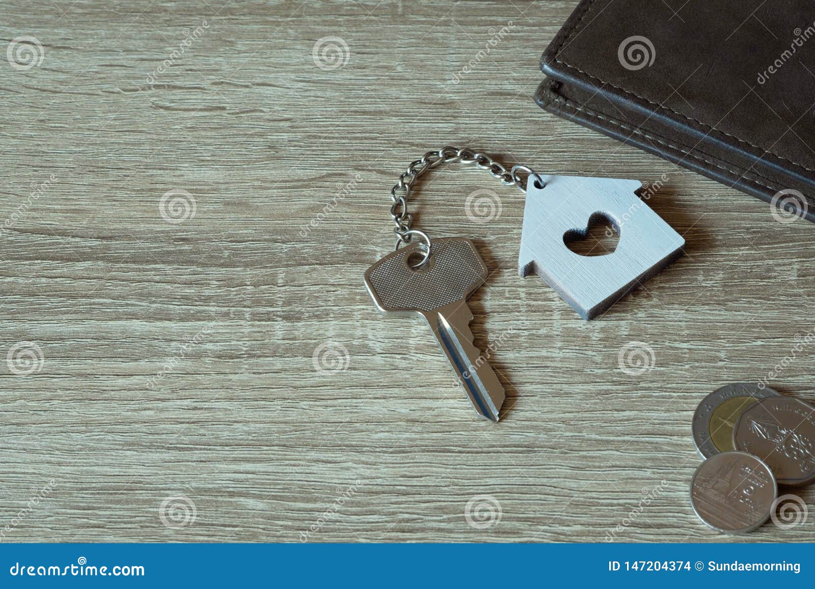 House Key With Home Keyring And Wallet On Wood Table Stock Photo