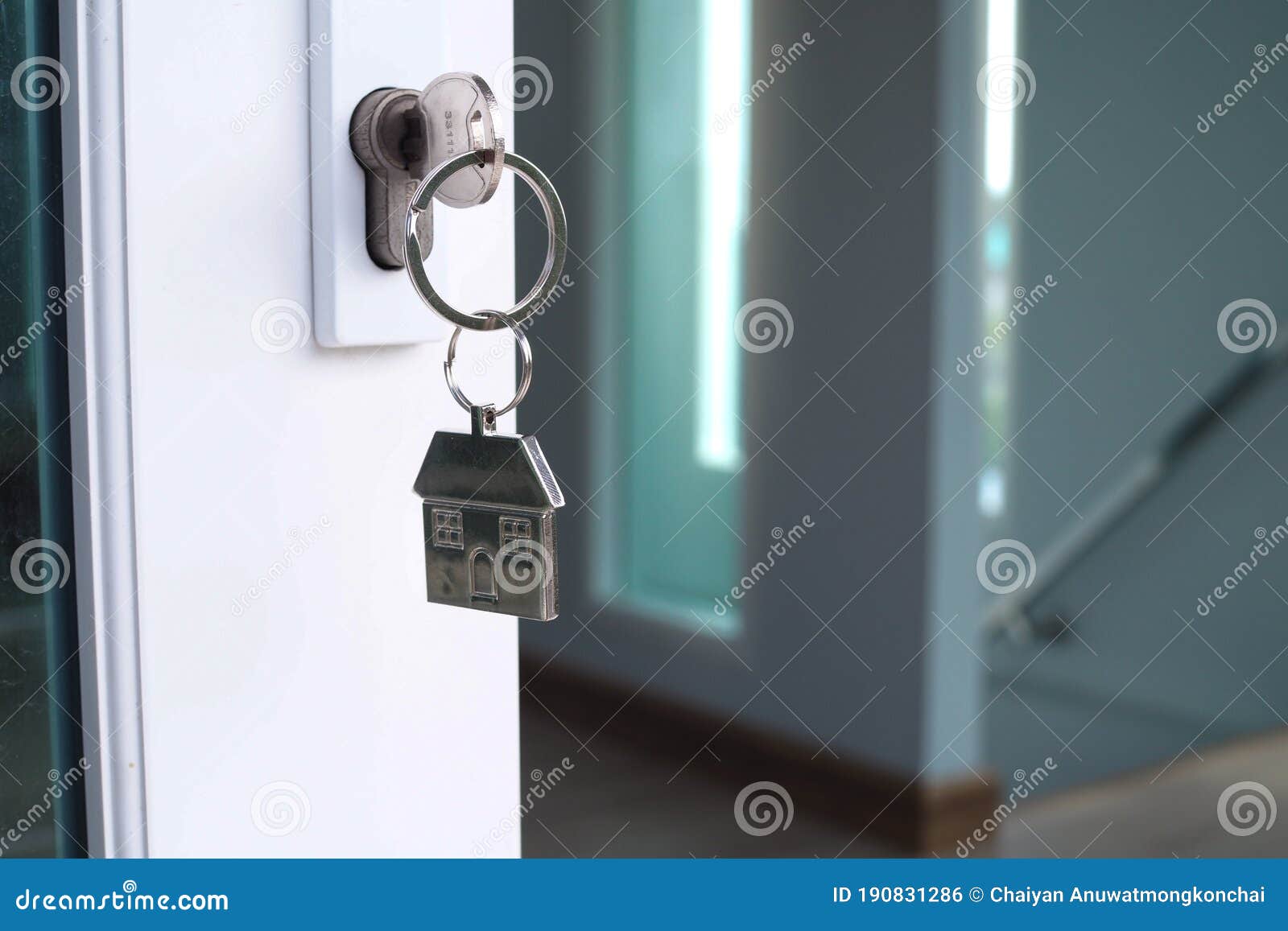 The House Key for Unlocking a New House is Plugged into the Door Stock