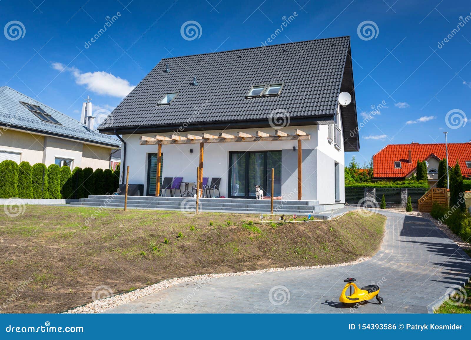 House with New Laid Concrete Paver Blocks Stock Photo - Image of