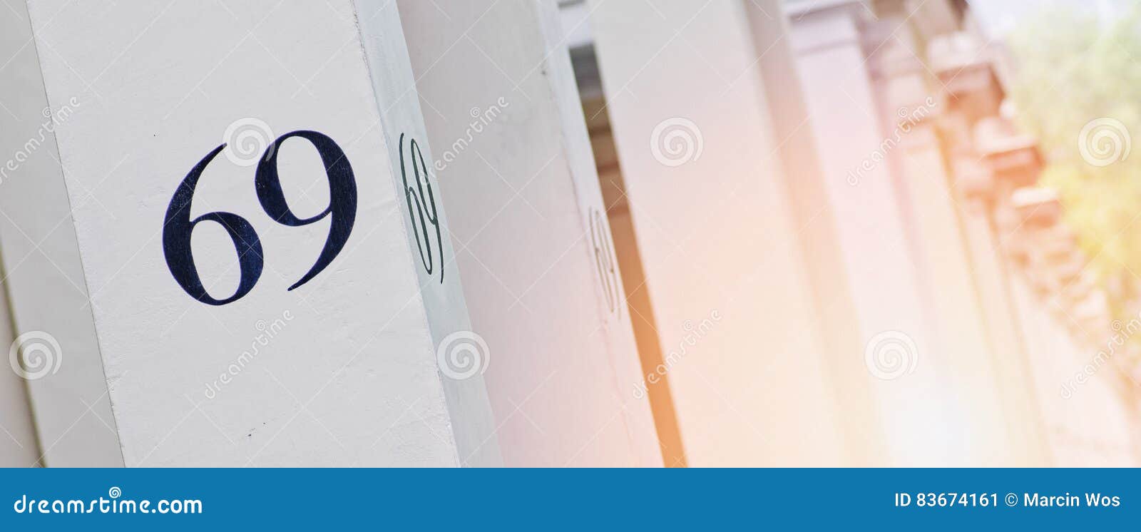 House Number 69 On White Pillar In London. Stock Photo CartoonDealer