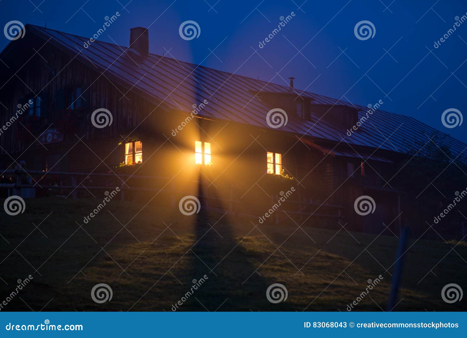 House With Orange Light During Night Time Picture. Image 83068043