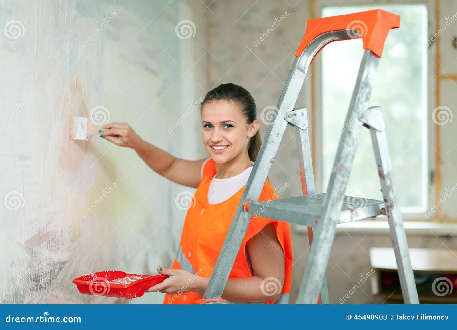 House painter paints wall stock image. Image of site 45498903