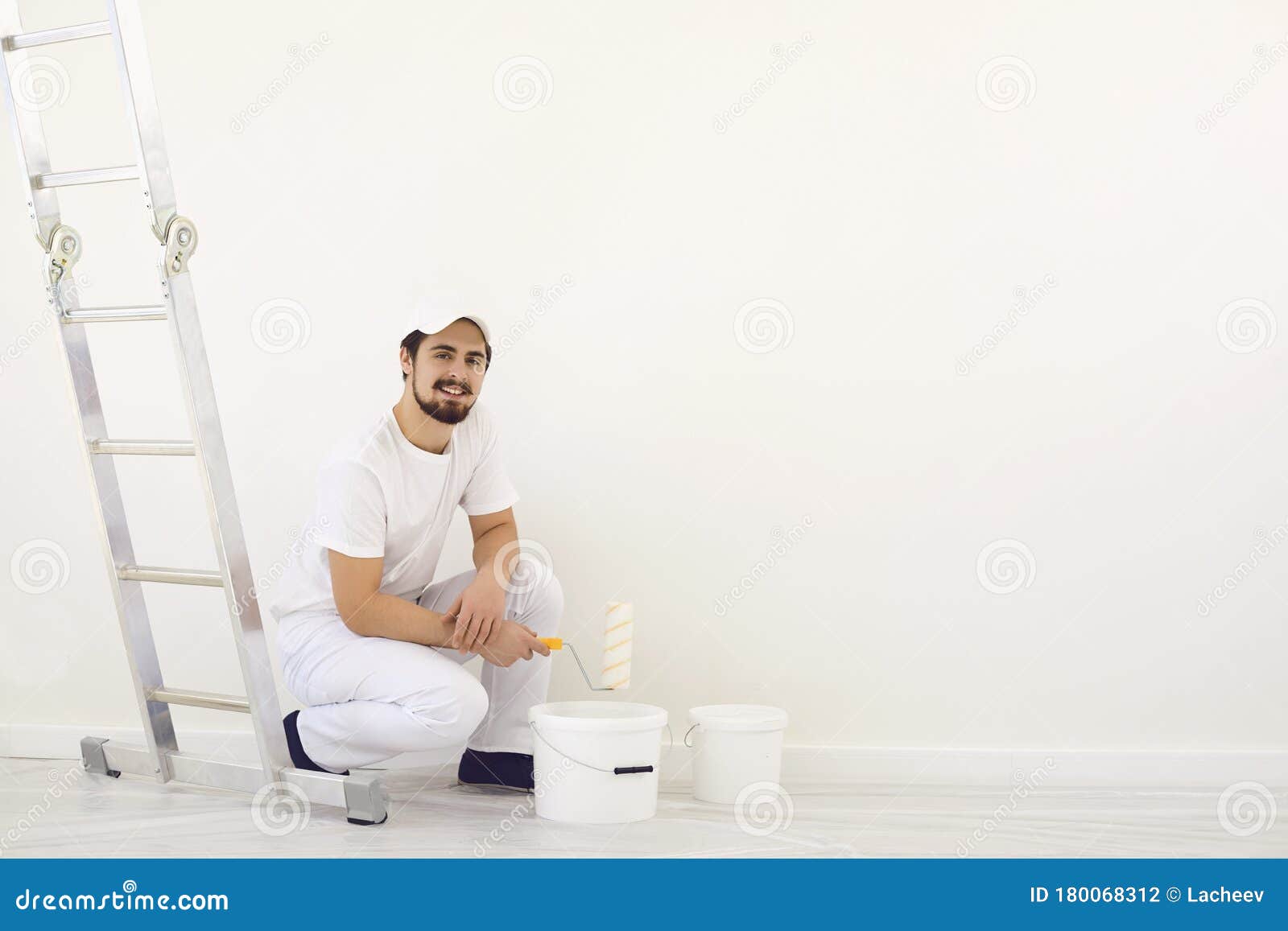House Painter in White Uniform on a White Background for Painting in