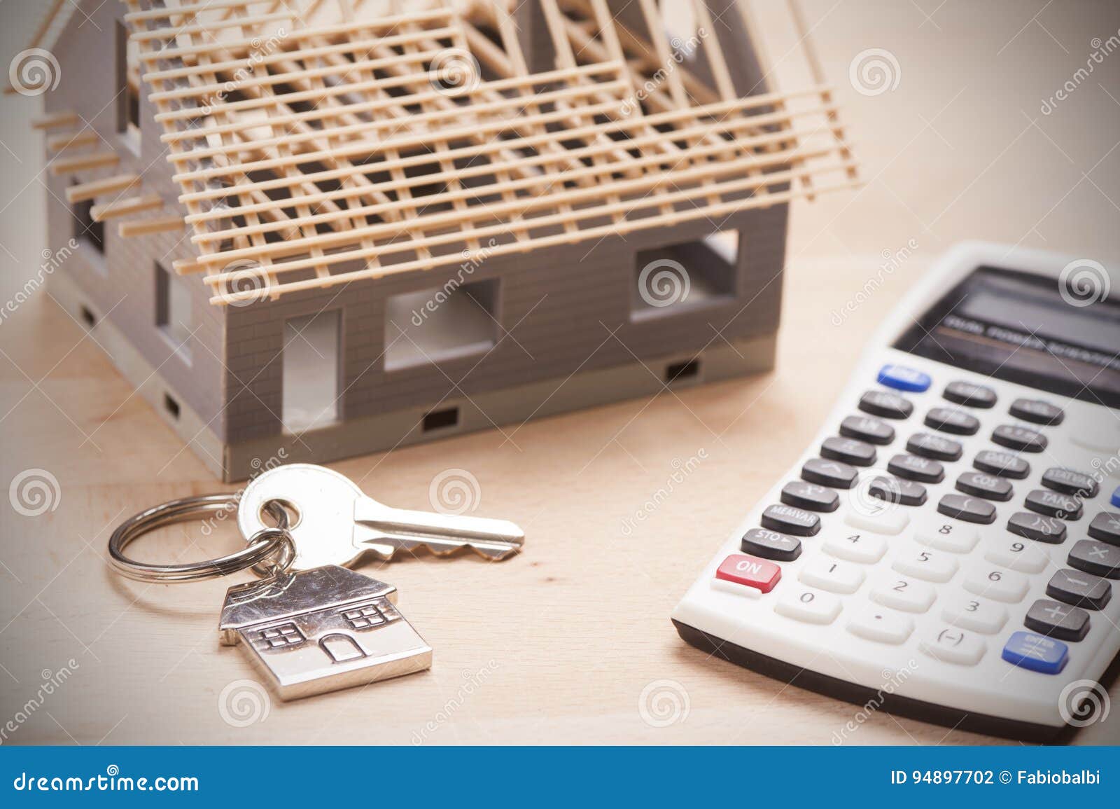 House shaped keyring on document