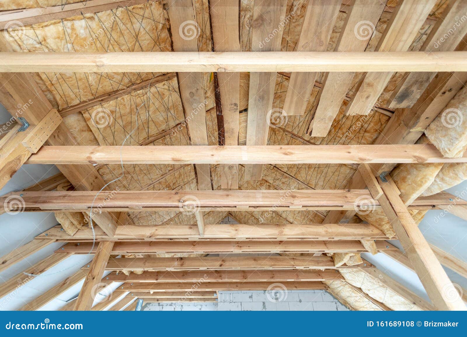 House Under Construction With Insulation Glass Wool On An Attic