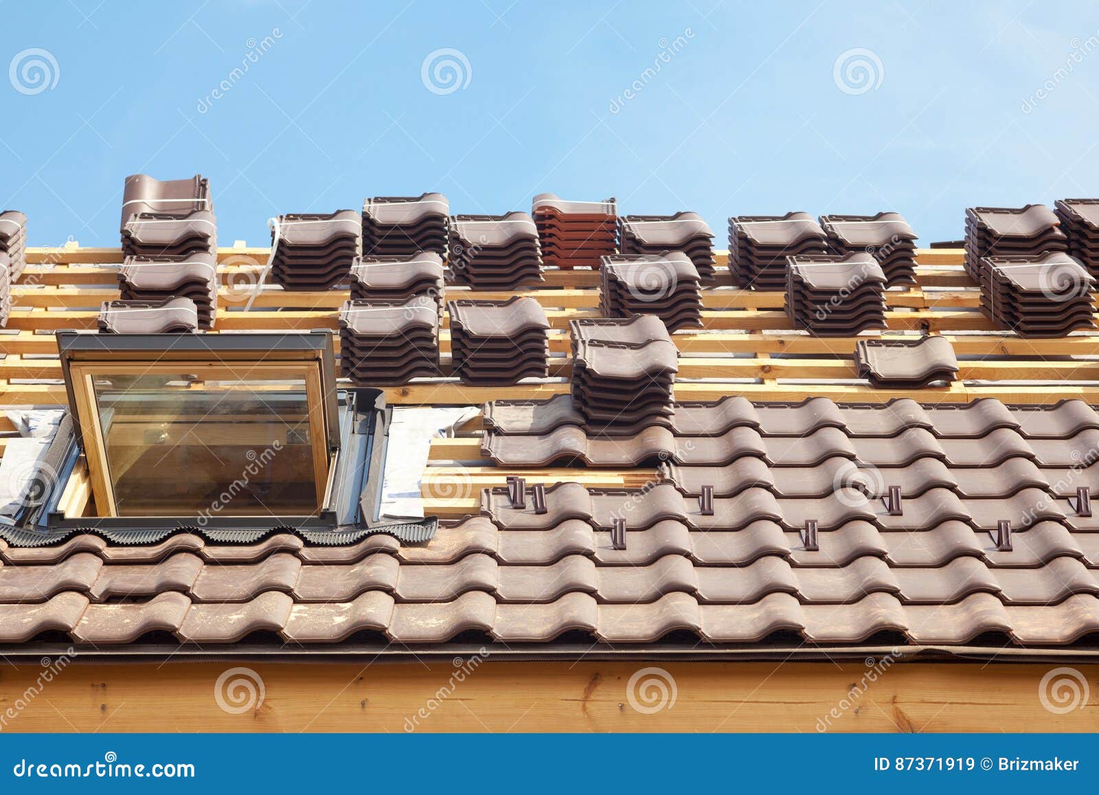 House Under Construction. Roofing Tiles with Open Skylight. Stock Image