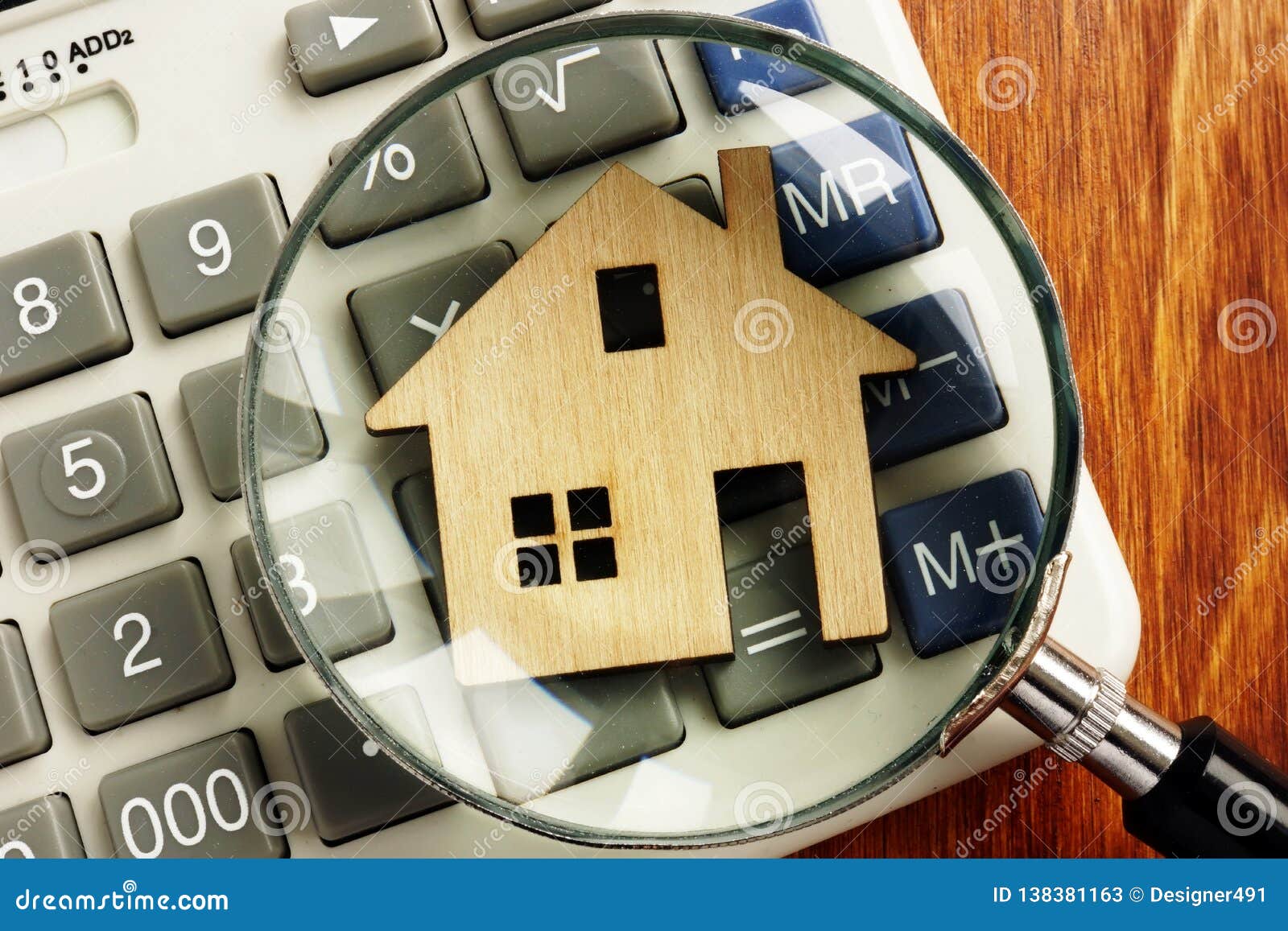 house value. model of home and magnifying glass