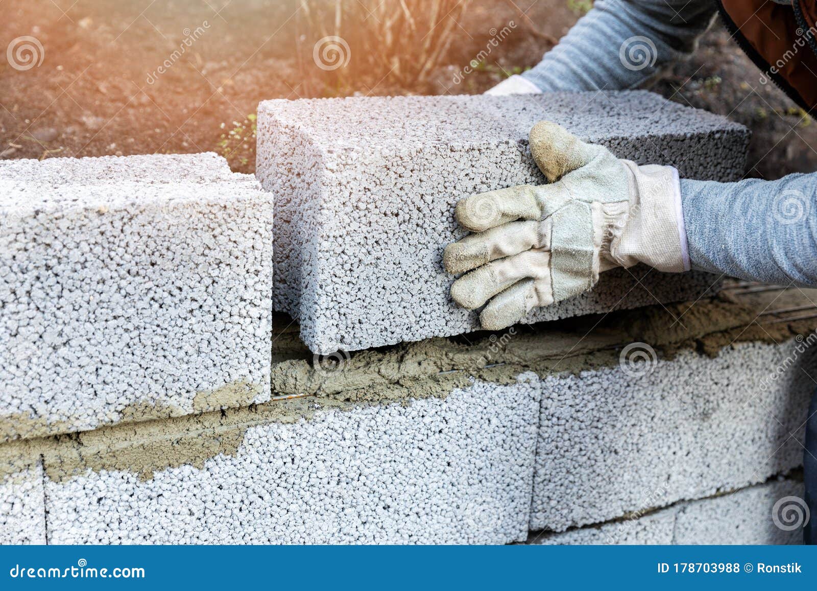 House Wall Construction - Mason Laying Expanded Clay Blocks Stock Photo