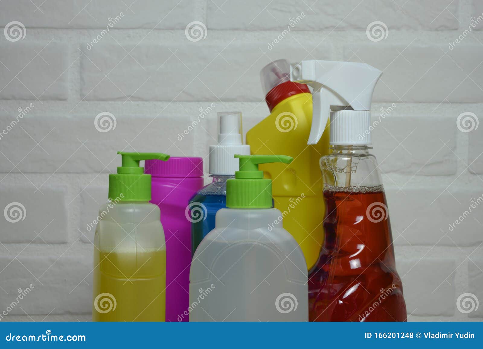 Household Chemicals in Kitchen on Background Tiles Stock Photo Image