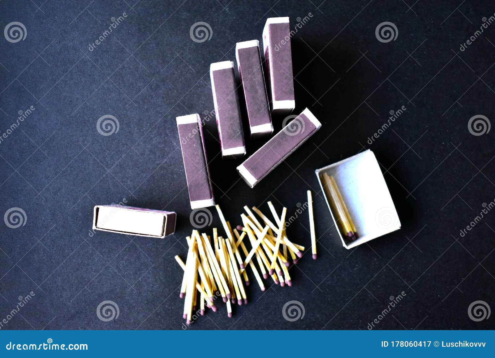 household matches and boxes for lighting on a blue background