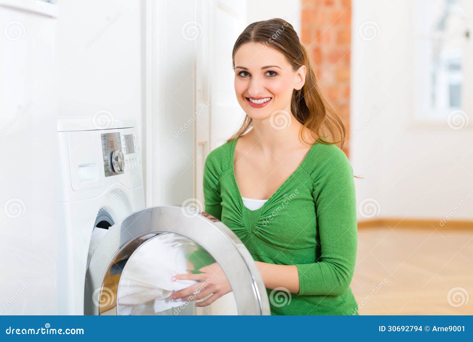Premium Photo  Closeup of housekeeper holding modern washing