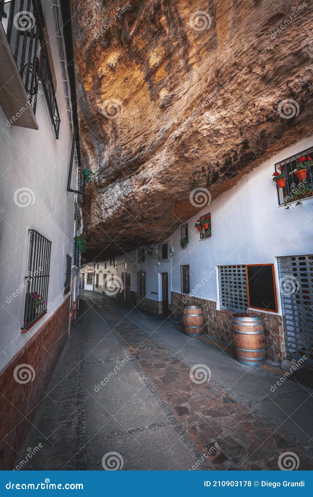 houses built into rocks at cuevas de la sombra street - setenil de las bodegas, cadiz province, andalusia, spain