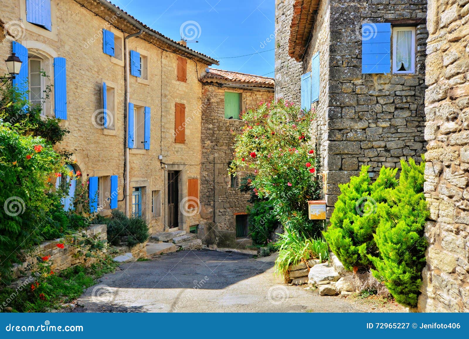 houses with colorful shuttered windows in provence, france