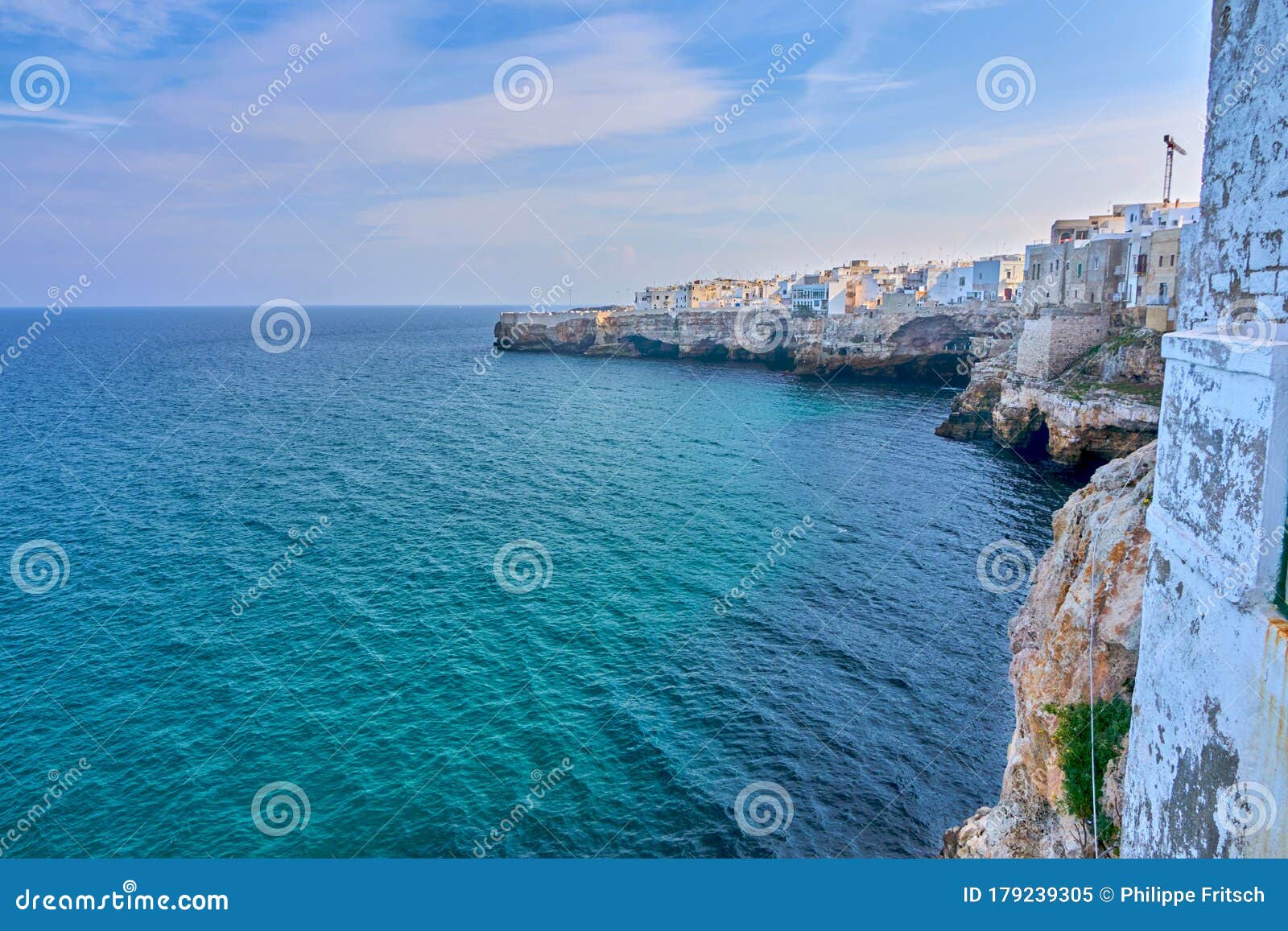 houses on dramatic cliffs over adriatic sea on a sunny autumn day at polignano a mare- apulia - italy