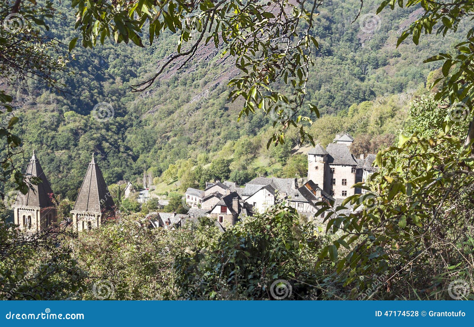 Houses in the mountains of conques in France, on a sunny day.