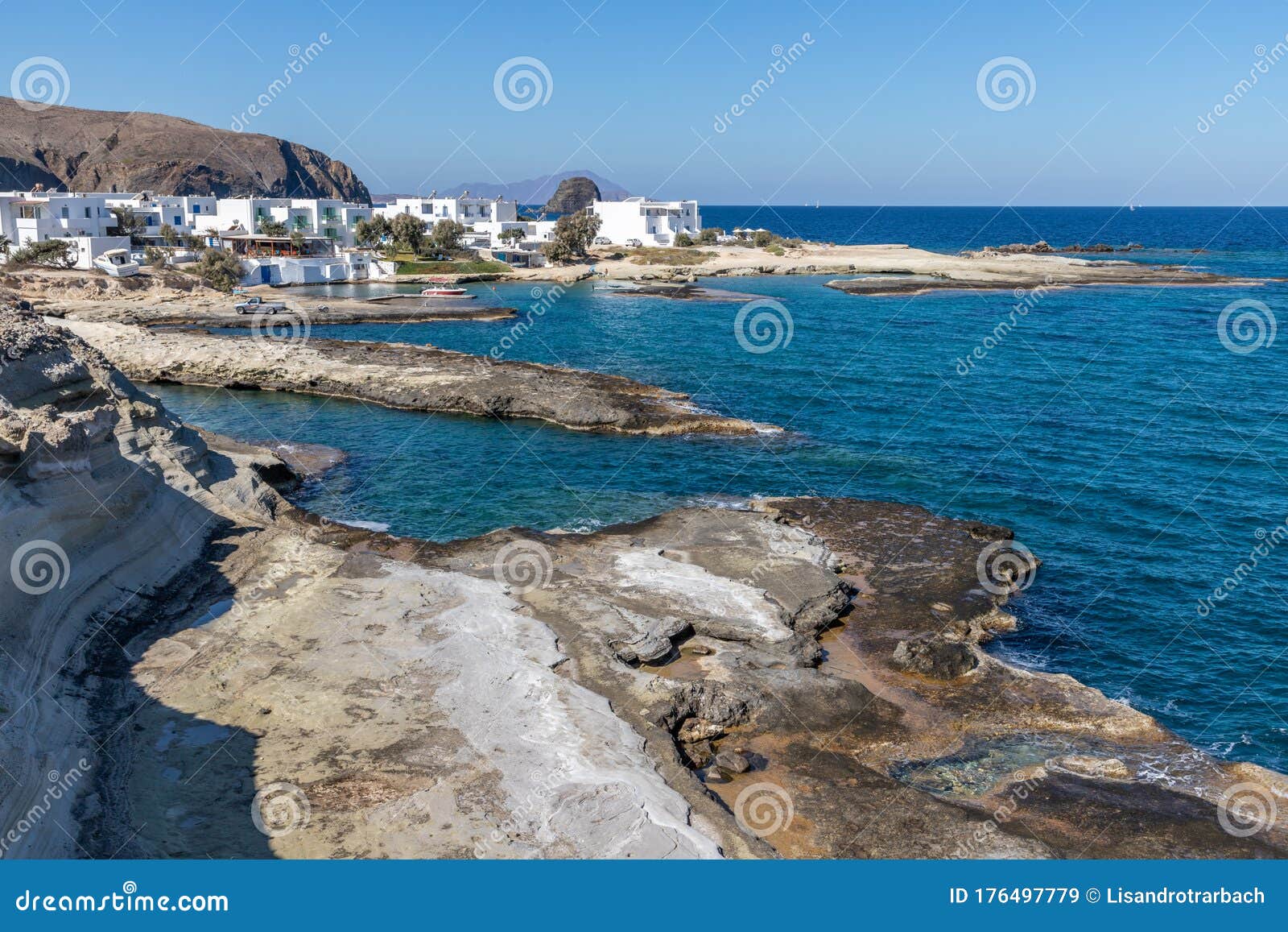 houses, rocks and cliffs in pollonia beach