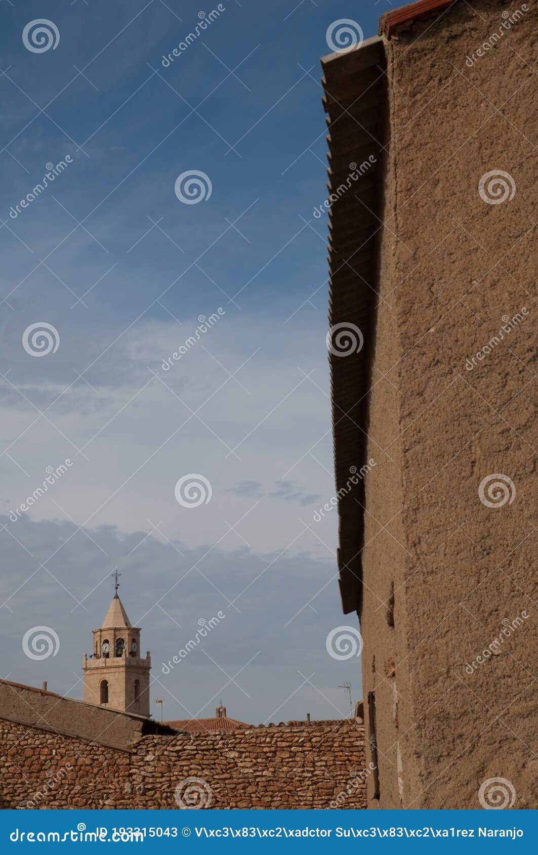 houses and tower of a church. bello.