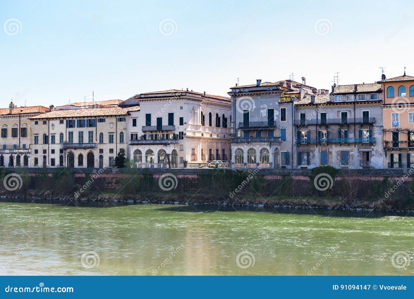houses on waterfronts in verona city in spring