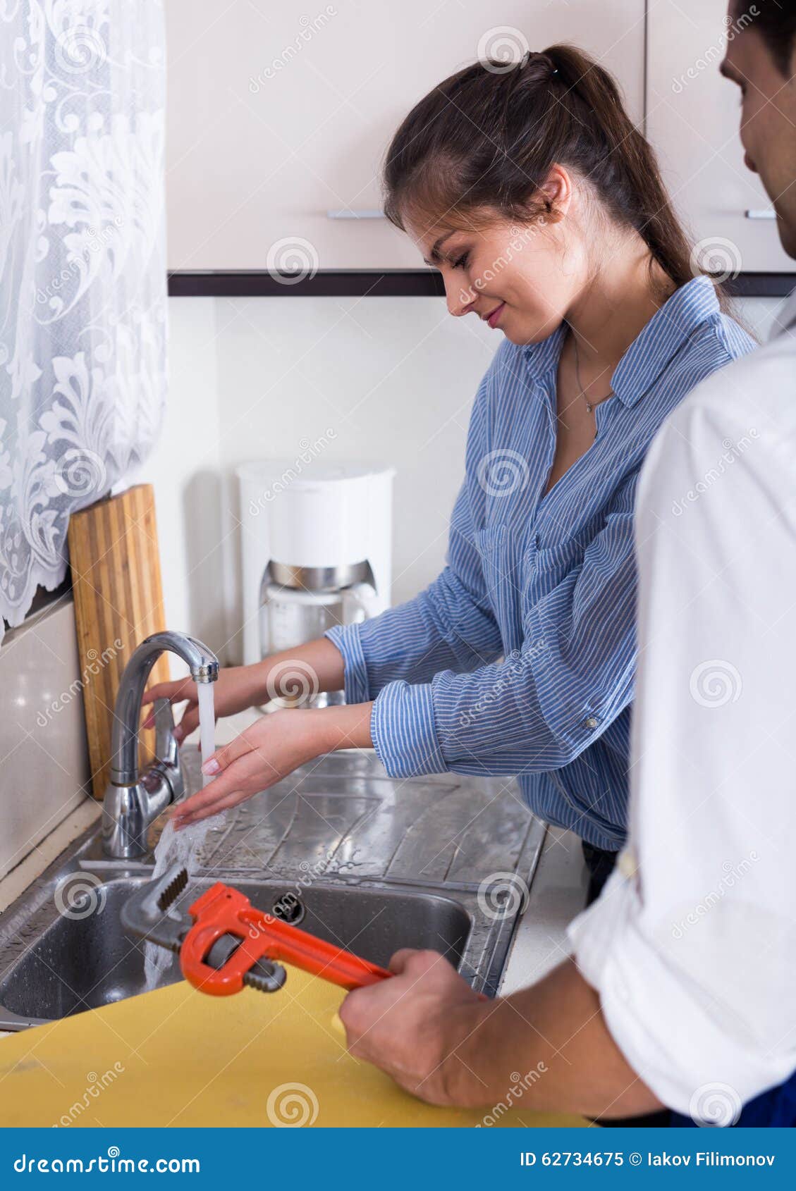 Housewife Called Professional Plumber with Tools To Change Bib image