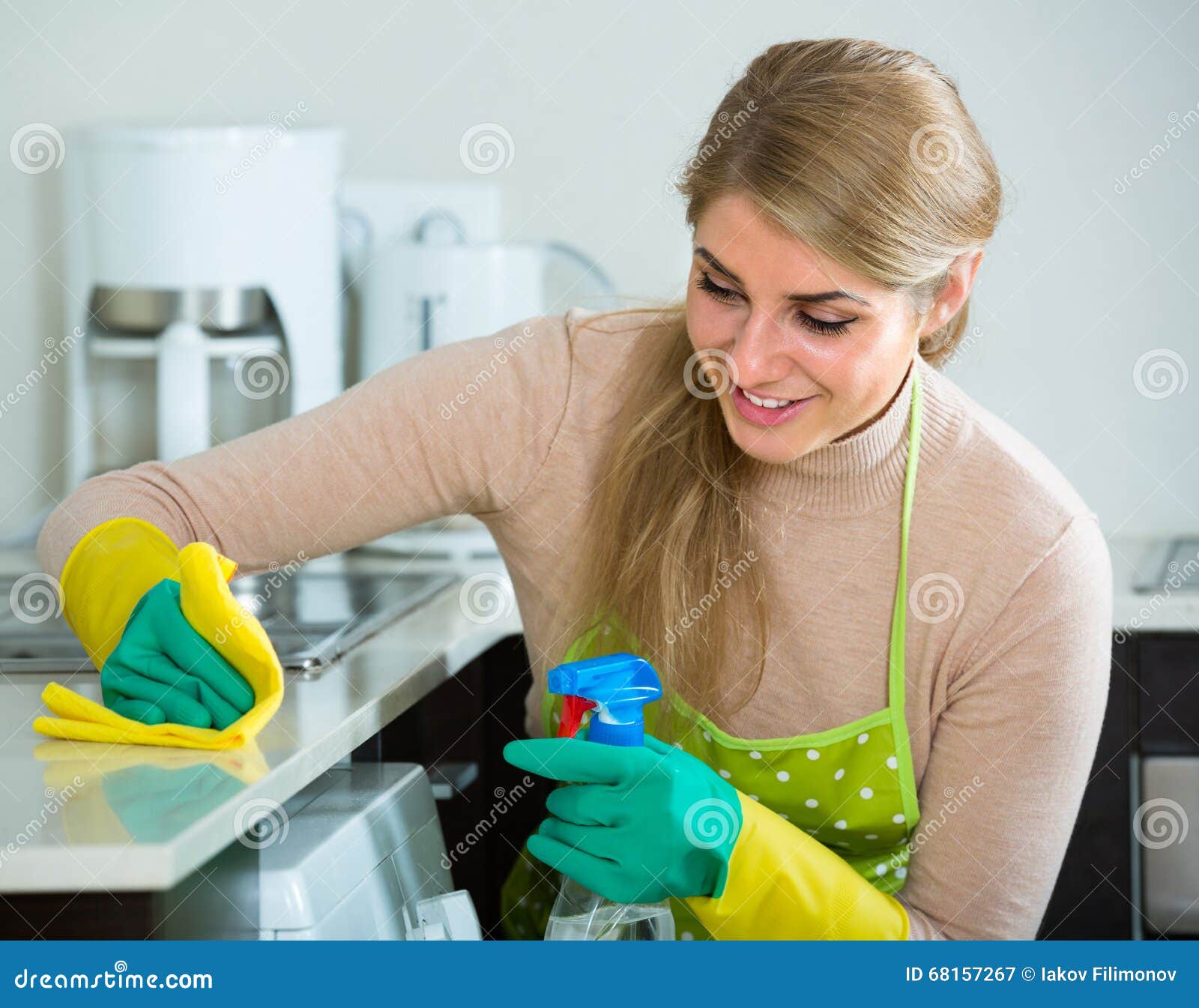 Housewife Cleaning In Home Kitchen Stock Imag