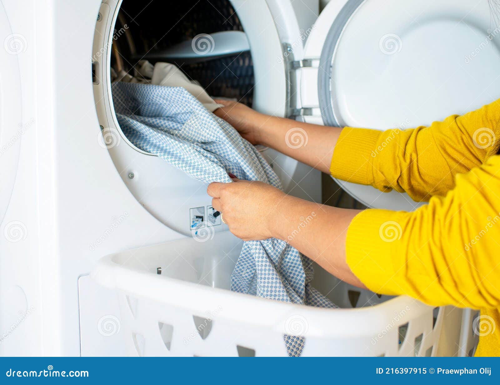 A housewife woman cleans the lint filter of the washing machine or tumble  dryer Stock Photo - Alamy