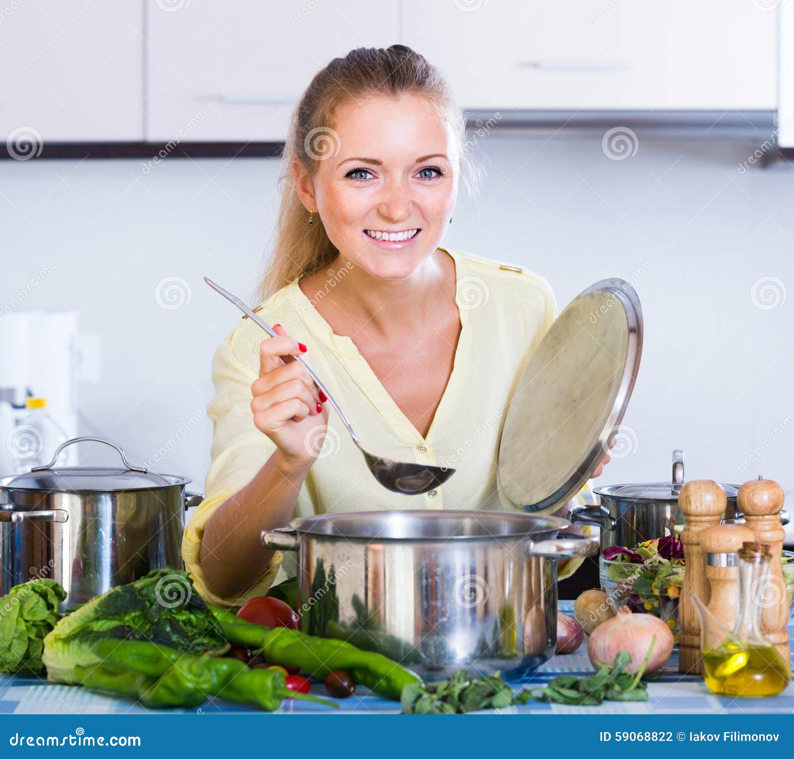 Housewife Cooking Vegetables At Domestic Kit