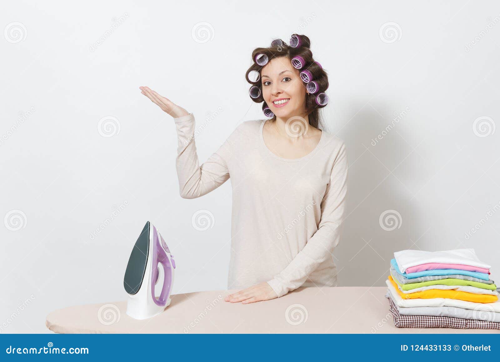 young pretty housewife. woman  on white background. housekeeping concept. copy space for advertisement.