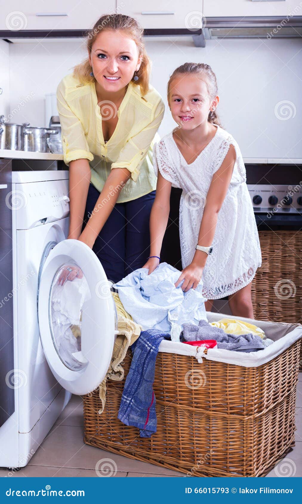 Housewife and Girl Doing Laundry Stock Im pic