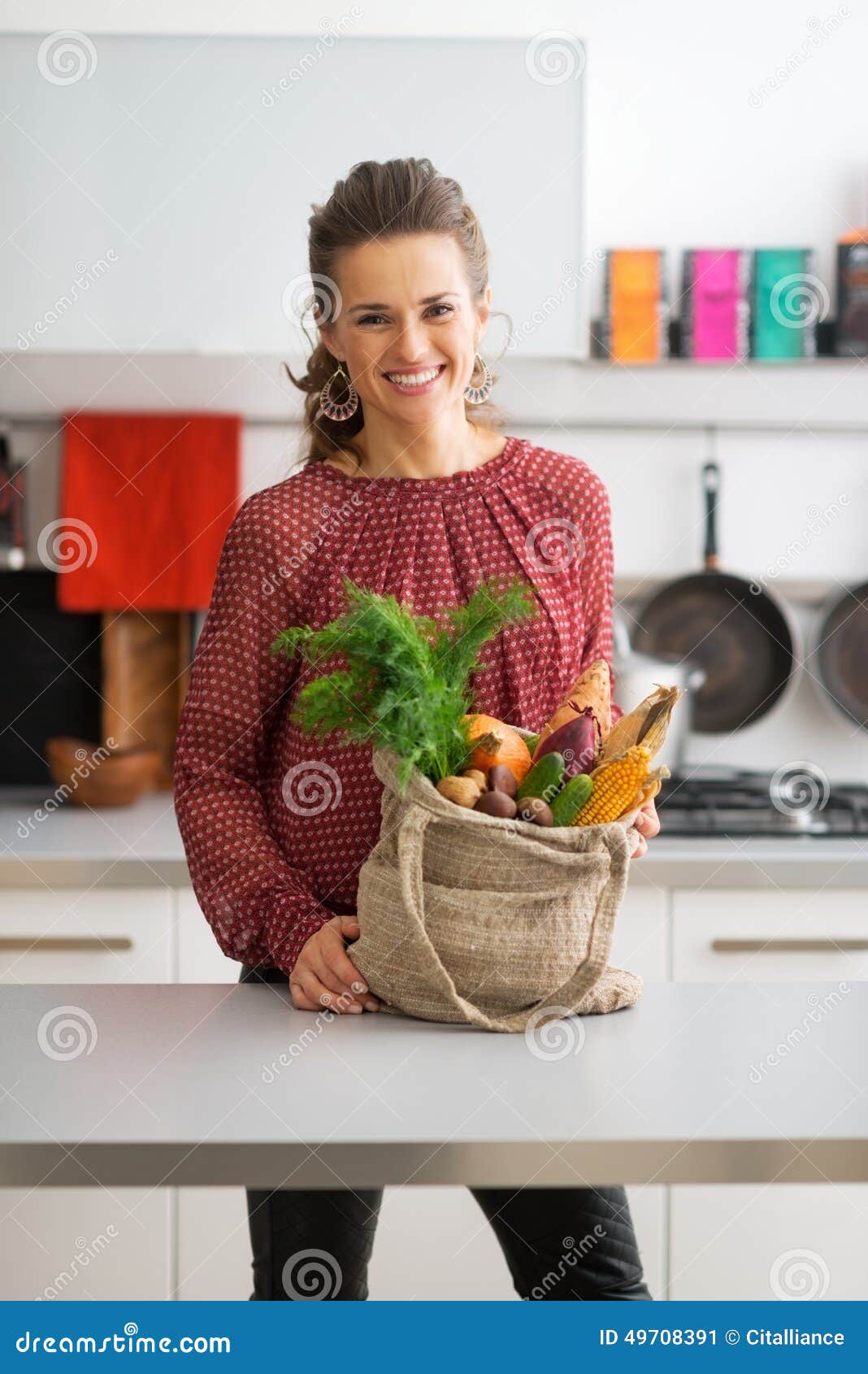 Housewife with Local Market Purchases in Kitchen Stock Im