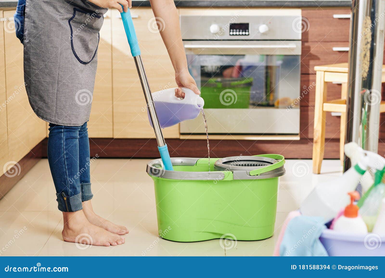 Housewife Pouring Floor Cleaning Liquid Stock Photo - Image of