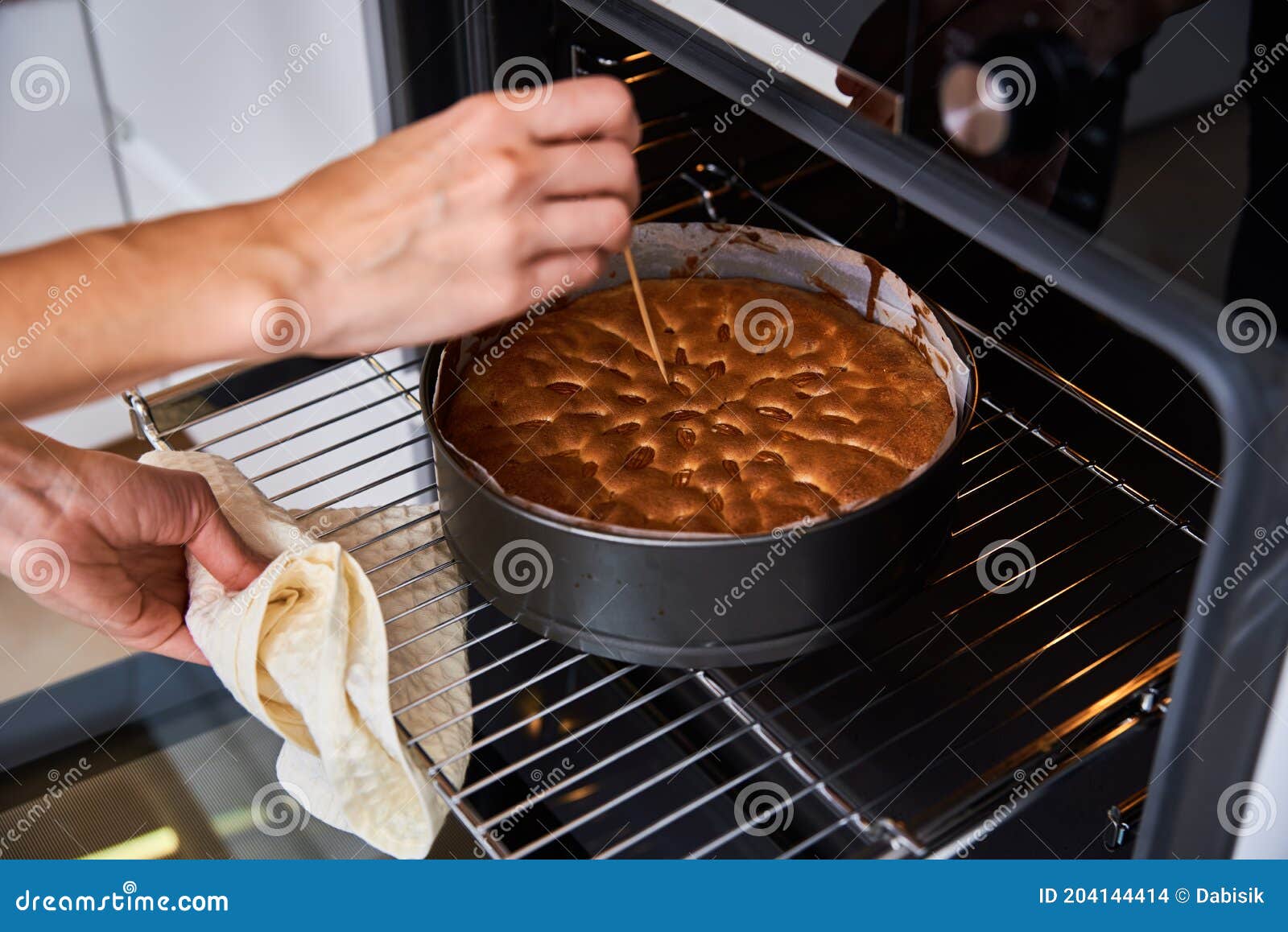 traditional homemade cake or sponge cake baking inside the oven Stock Photo  | Adobe Stock