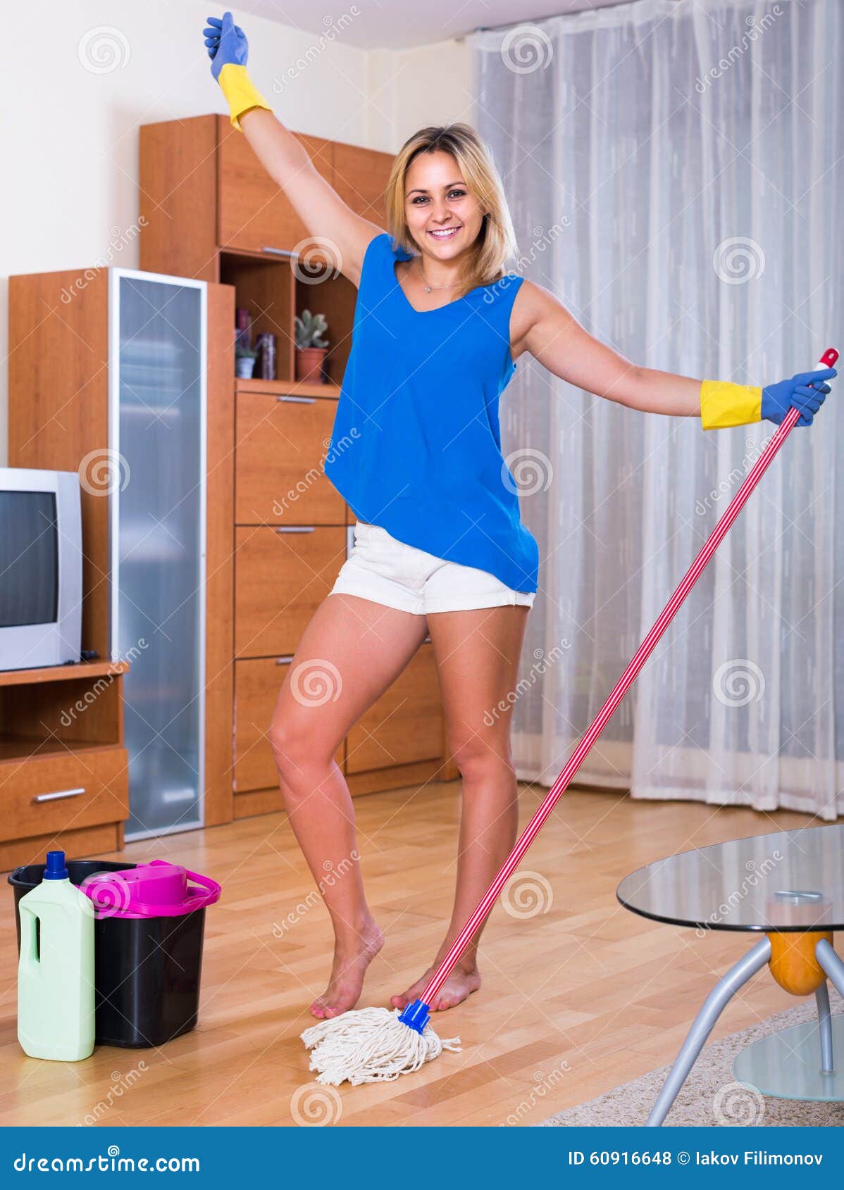 Housewife Smiling And Doing Floor Cleaning I