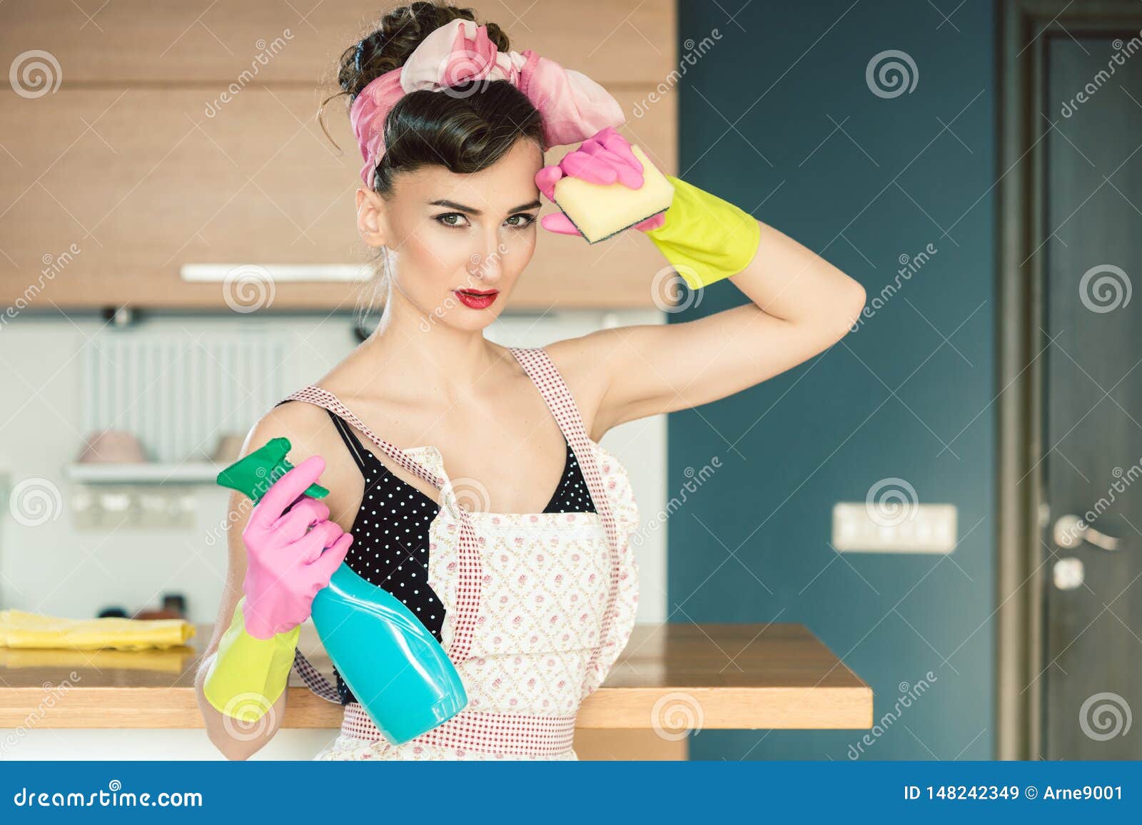 Housewife Woman in Retro Outfit Attempting To Clean the Kitchen Stock Image 