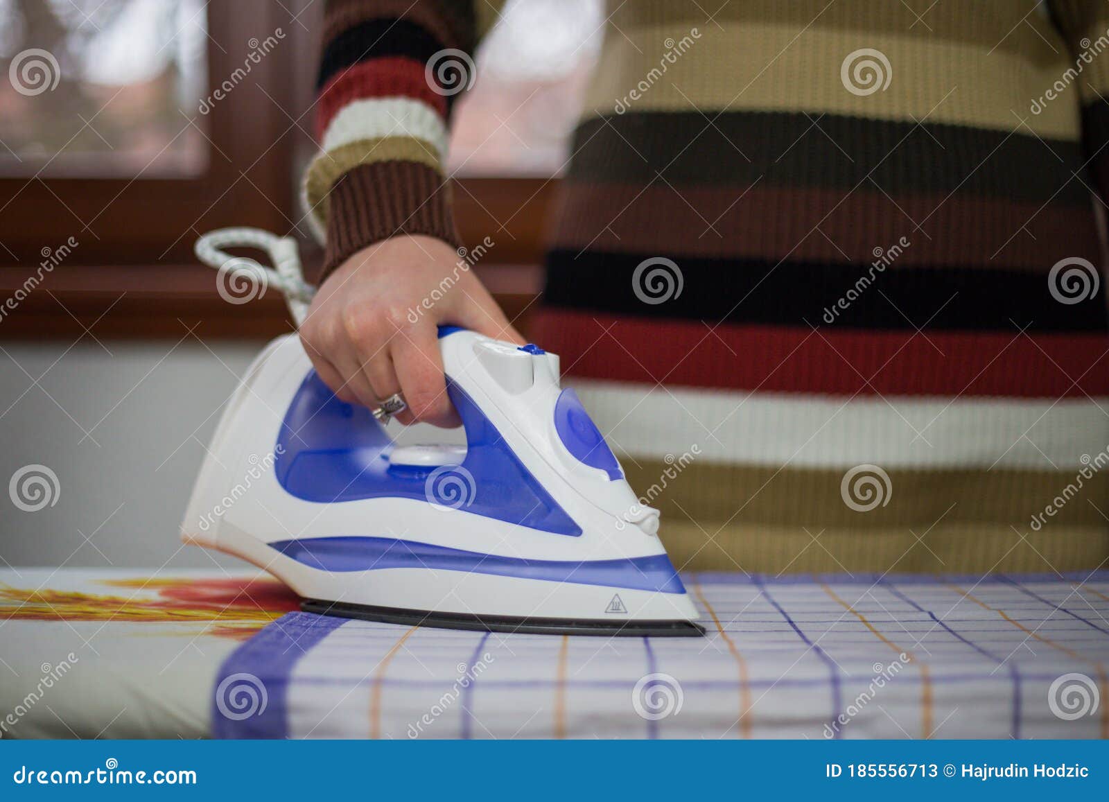Housewife Work, a Housewife Does Her Job,iron and Ironing Board