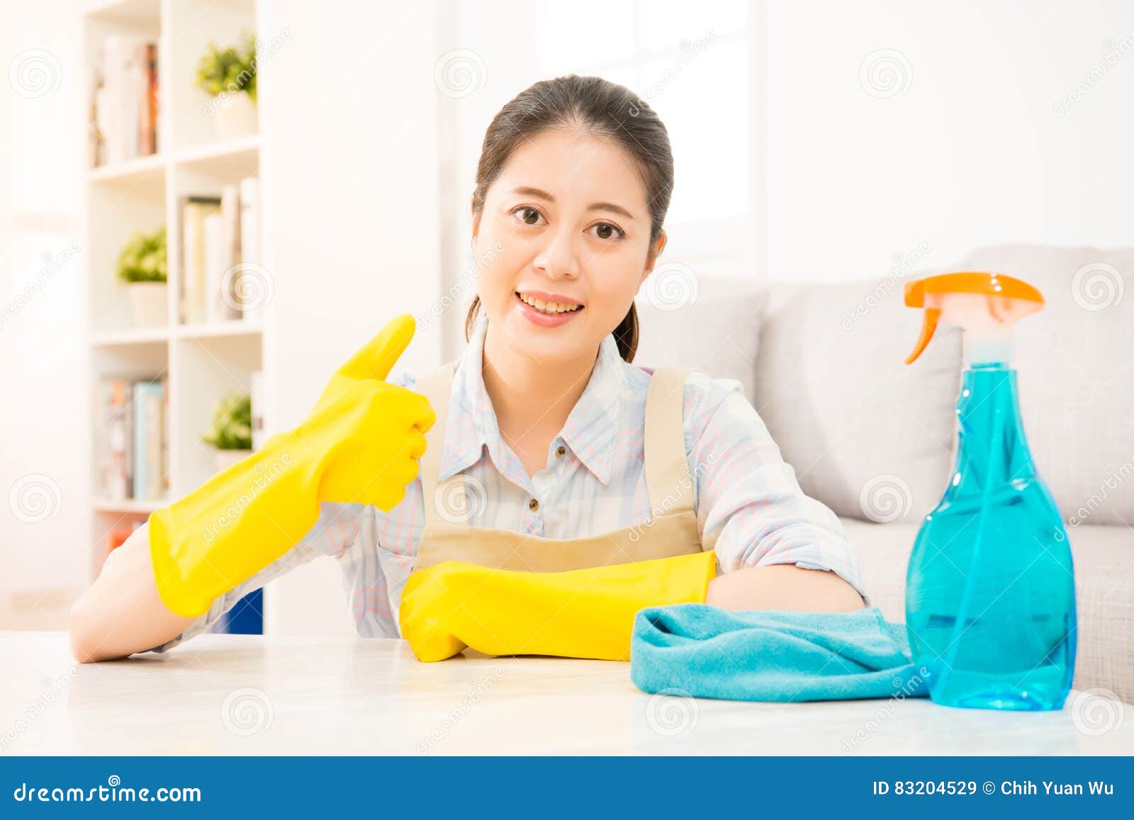 Housewife in Yellow Gloves Showing Thumbs Up Stoc picture