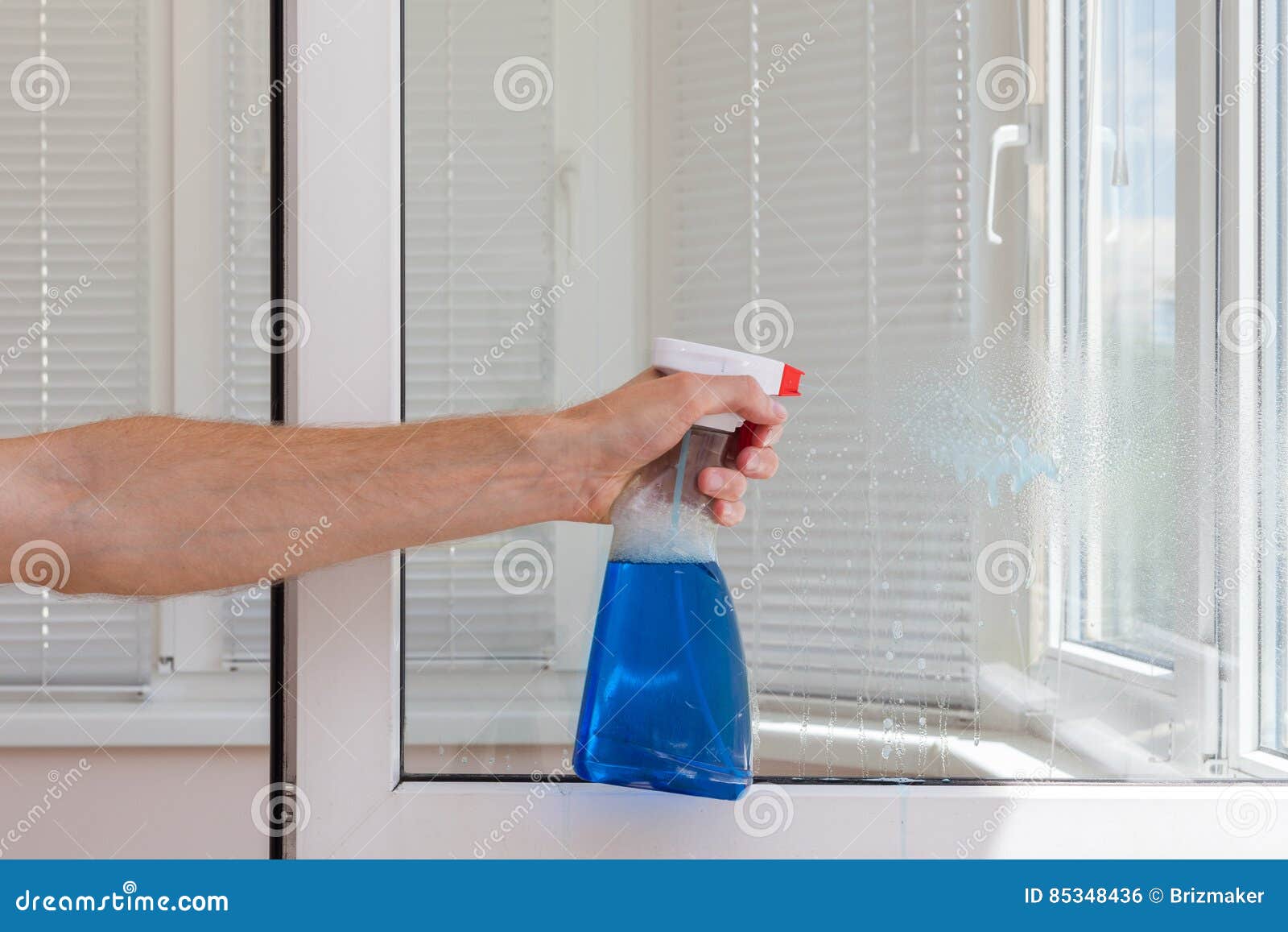 Houseworker Clean Plastic Pvc Windows with Detergent. Stock Photo