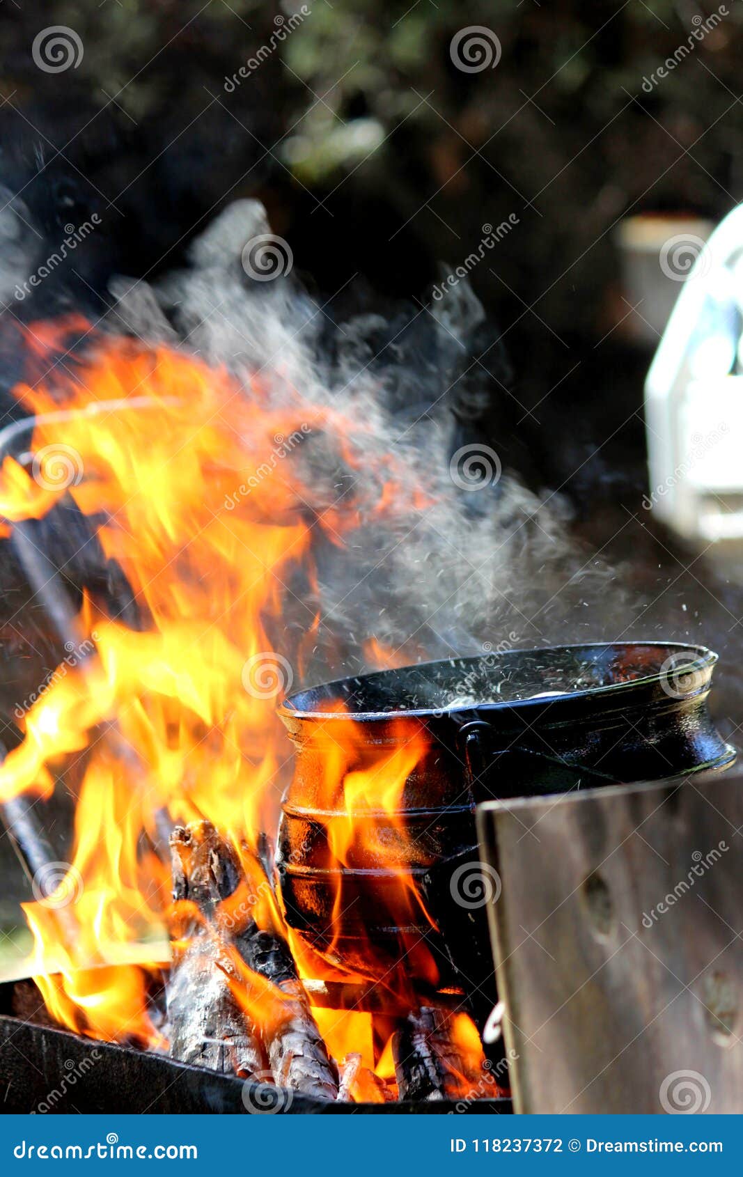 Cooking on a open flame stock photo. Image of flame 118237372