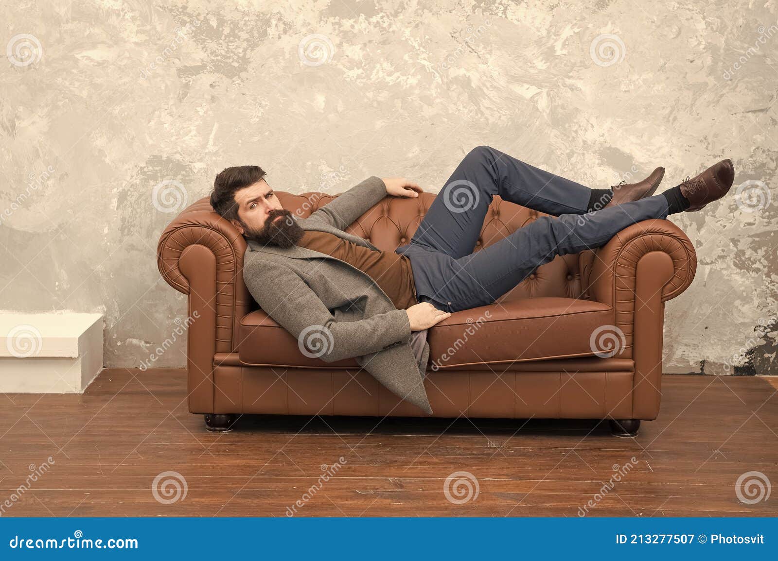 This is How Confidence Looks Like in Man. Bearded Man Relax on Sofa ...