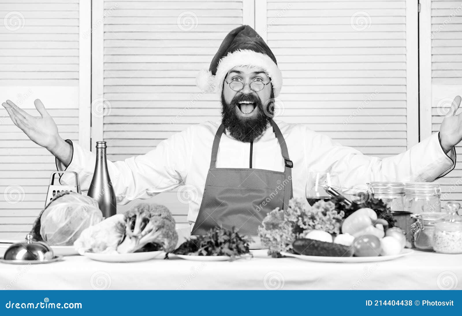 how make your christmas dinner healthier. how to enjoy holiday meals. man bearded chef wear santa claus hat cooking