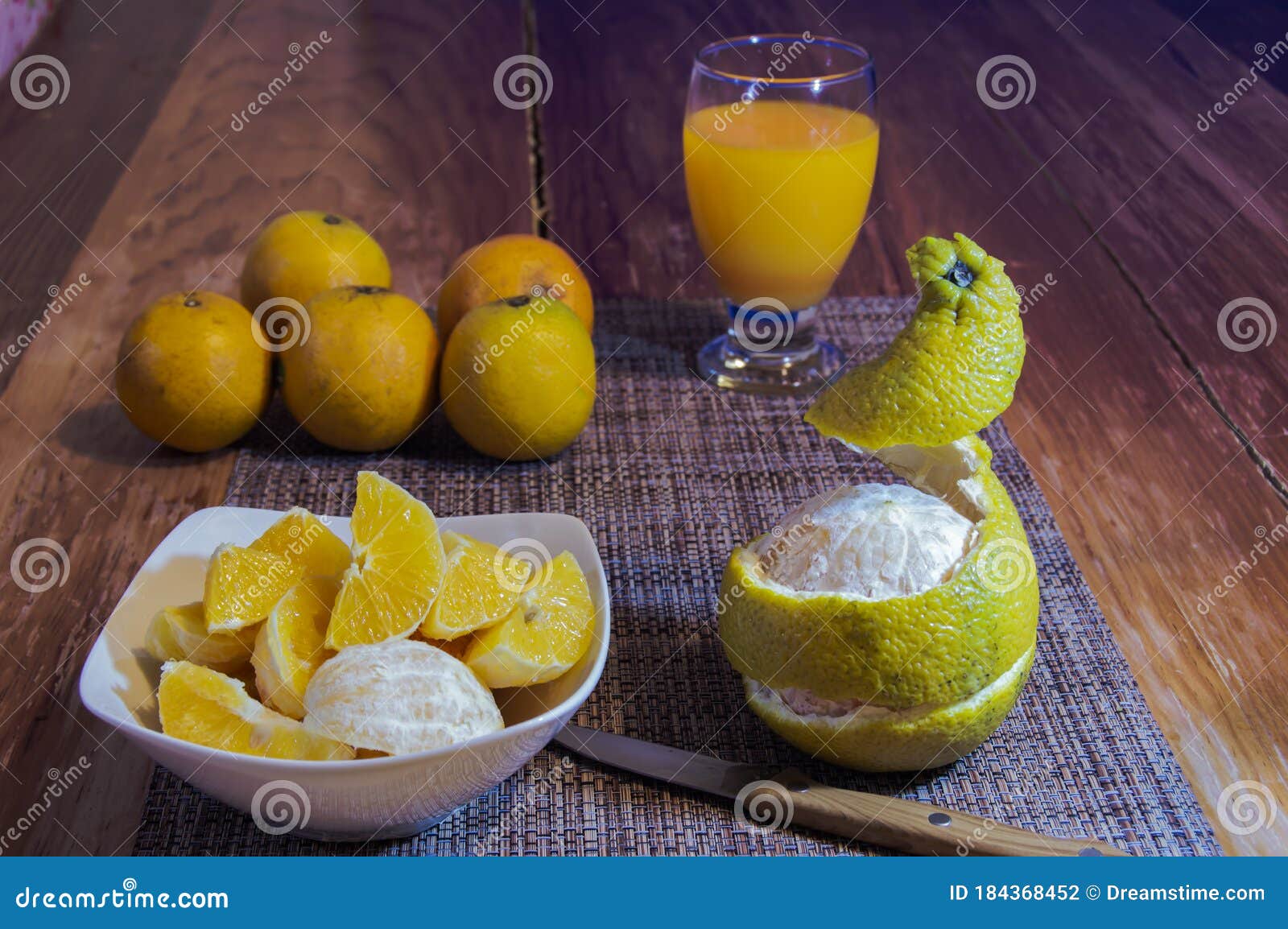 How to eat orange wedges stock photo. Image of dish - 184368452