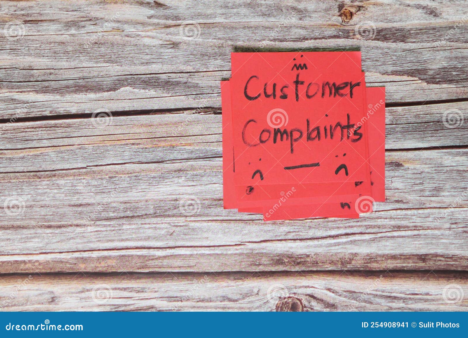 How to handle customer complaint concept hand holding red note with