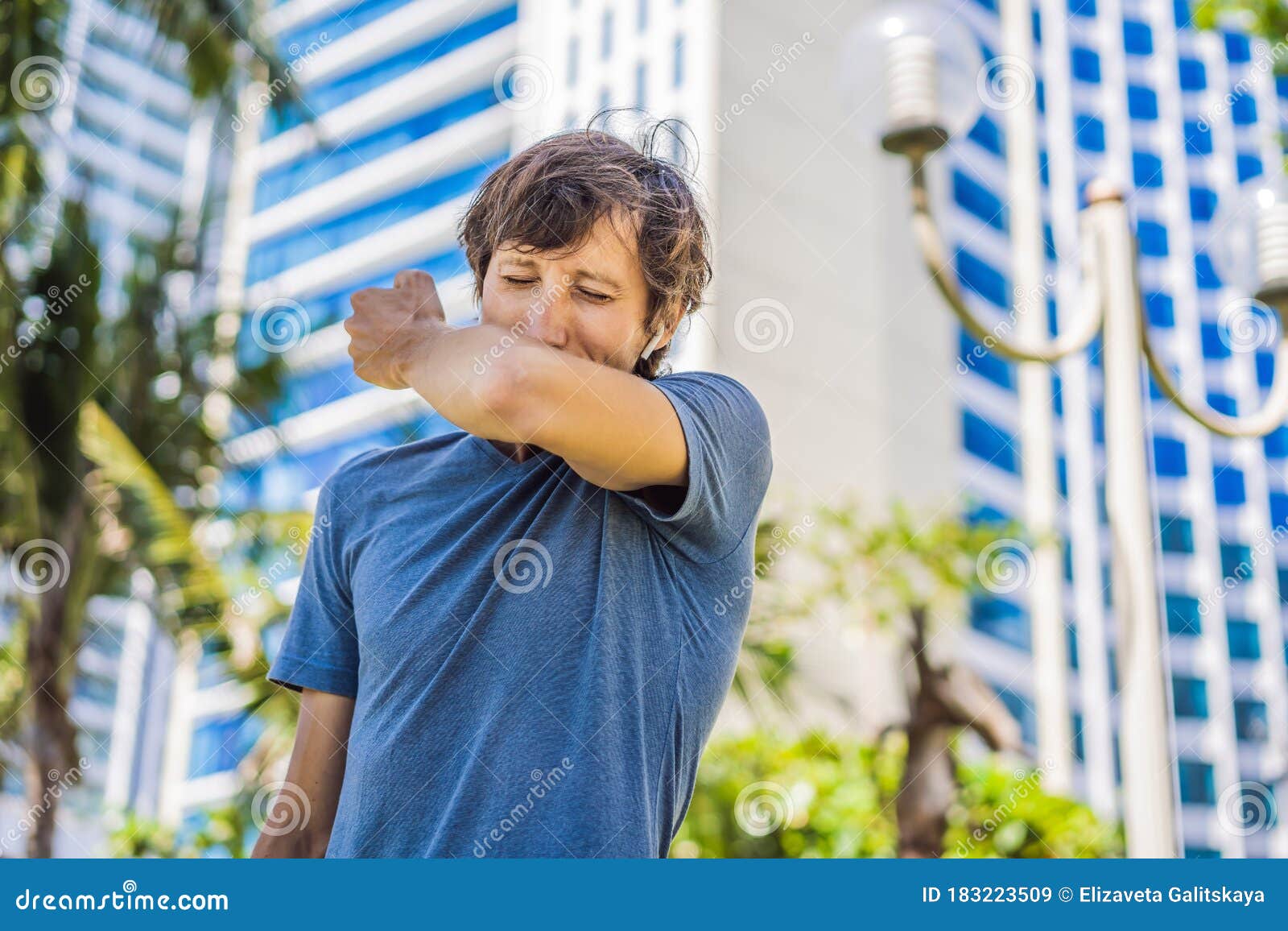how-to-sneeze-correctly-man-sneezes-on-the-elbow-stock-image-image