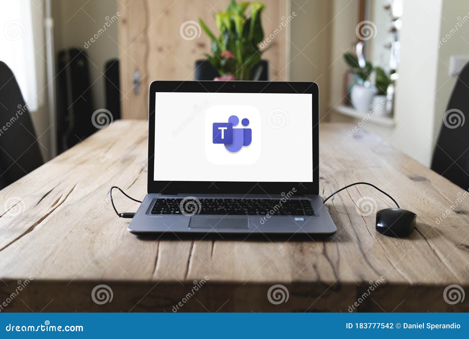 HP Laptop on Table with Microsoft Teams on Screen Editorial Photography