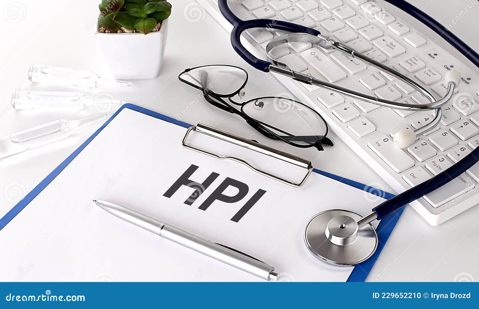 HPI Text on White Paper on White Background. Stethoscope ,glasses and