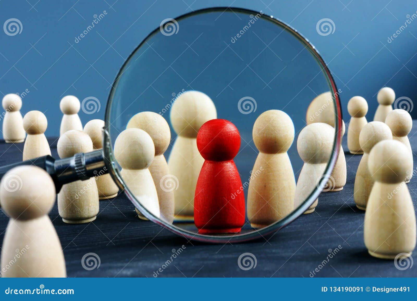 hr human resources and recruitment. wooden figures and magnifying glass