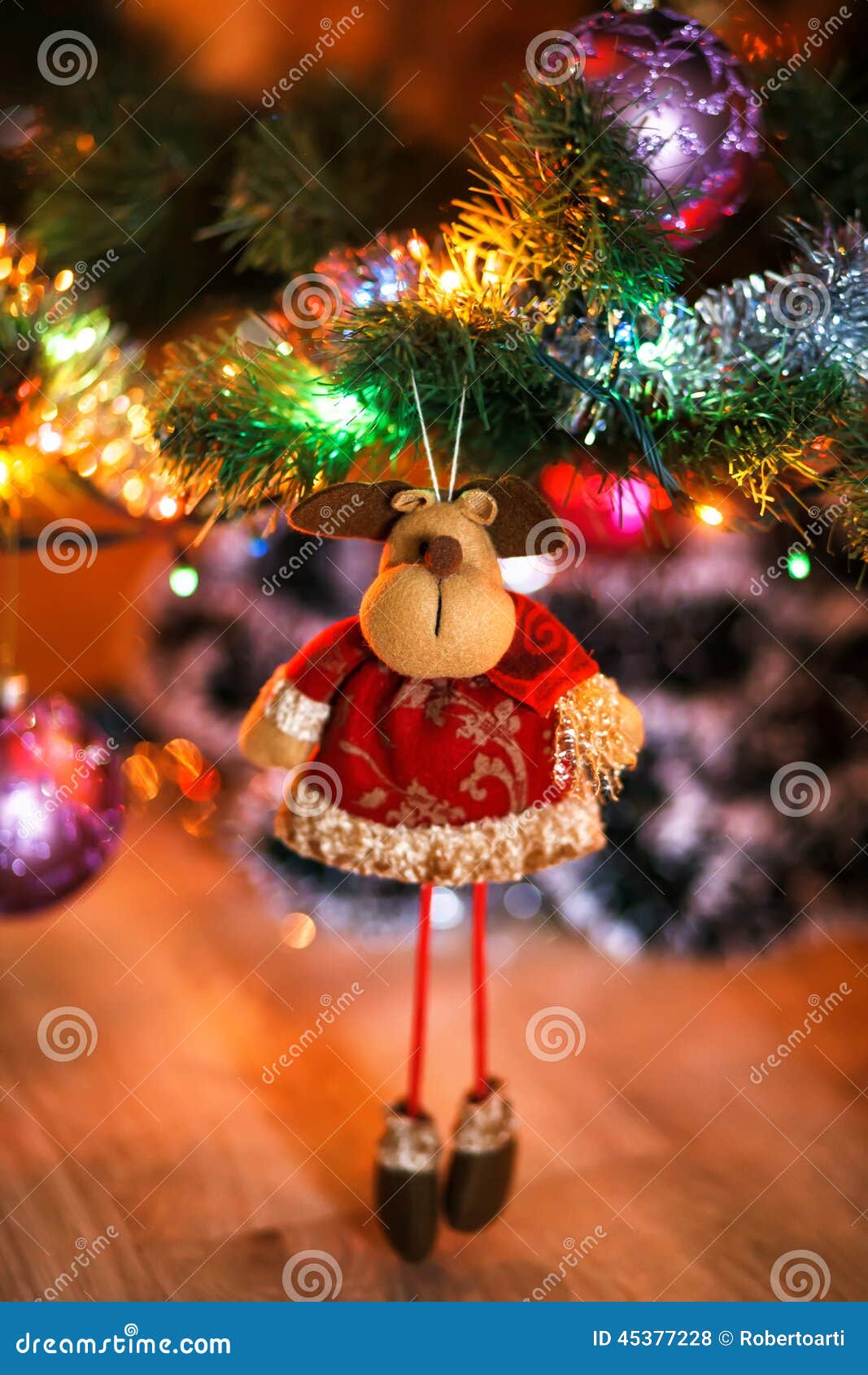 ÃÂ¡hristmas deer stuffed toy on christmas tree.