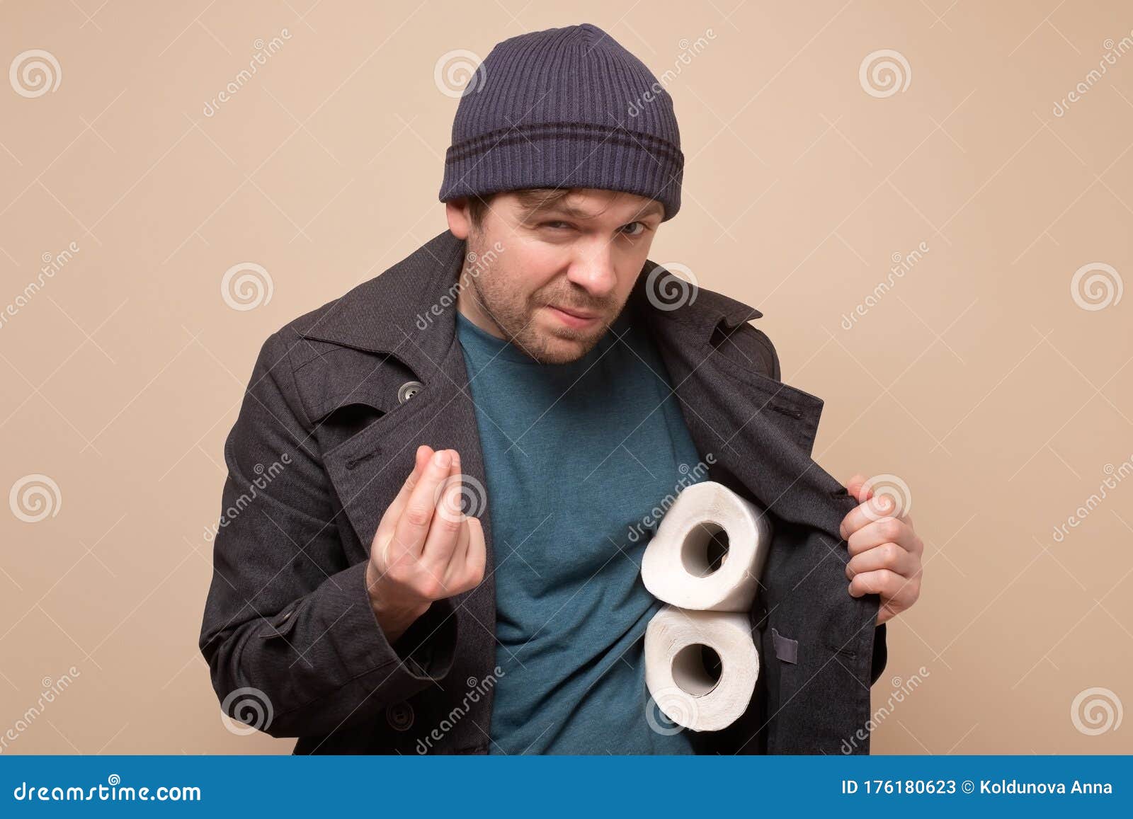 huckster man holding several roll of toilet paper. do you want to buy it
