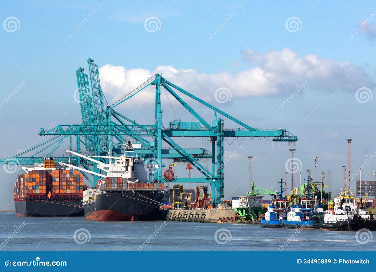 huge container ship being unloaded with cranes in antwerp container terminal - all recognizable logos and brands have been removed