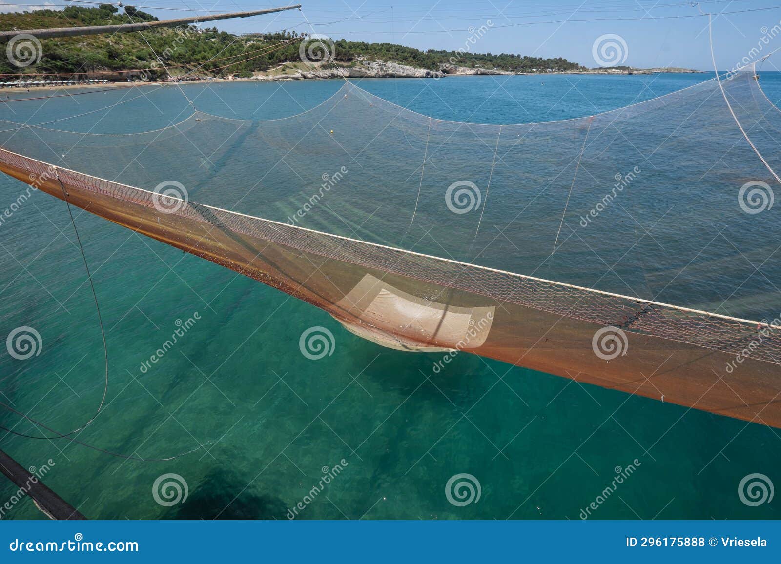Huge Fishing Net is Pulled Up by Ropes in a Traditional Fishing Trabucco in  Italy Stock Photo - Image of coast, italy: 296175888